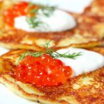 latkes with salmon roe and sour cream from The Jewish Kitchen